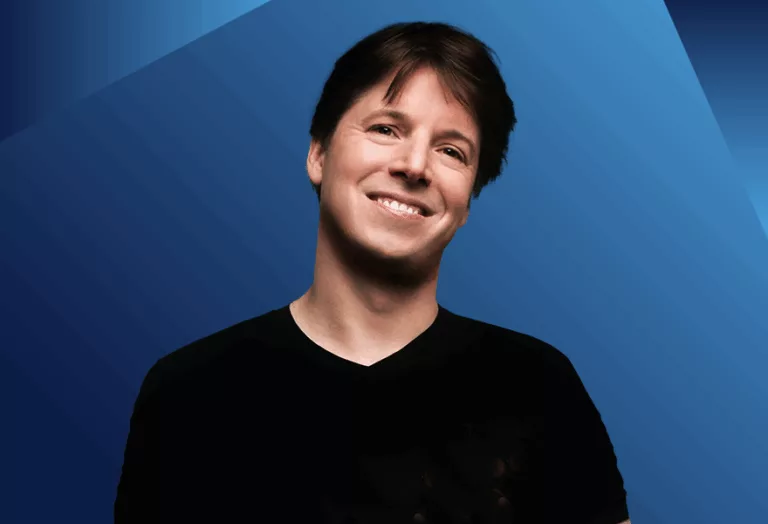 Violinist Joshua Bell with a blue background